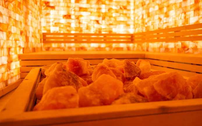 Salt room with warm lighting at QC Terme Chamonix spa.