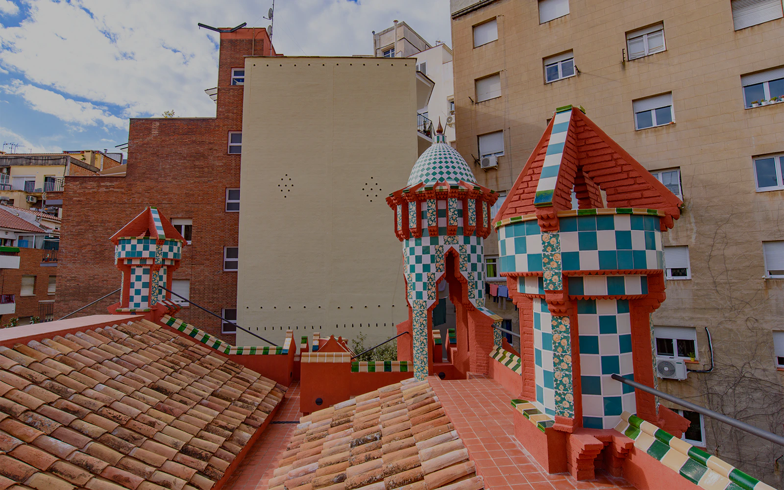 Casa Vicens rooftop with colorful tiled turrets in Barcelona.