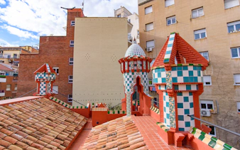 Casa Vicens rooftop with colorful tiled turrets in Barcelona.