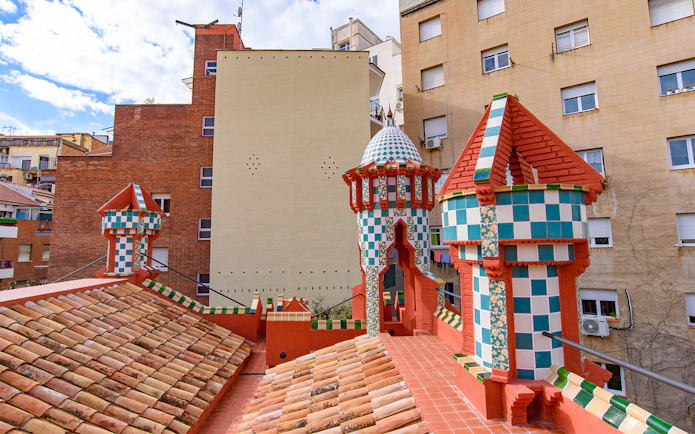 Casa Vicens rooftop with colorful tiled turrets in Barcelona.