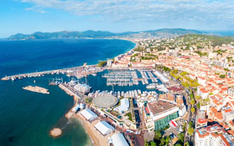 Aerial view of Monaco coastline and marina during a private helicopter tour.