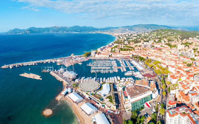 Aerial view of Monaco coastline and marina during a private helicopter tour.