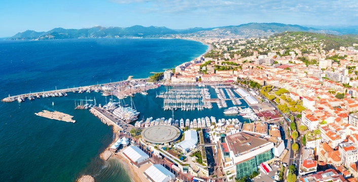 Aerial view of Monaco coastline and marina during a private helicopter tour.