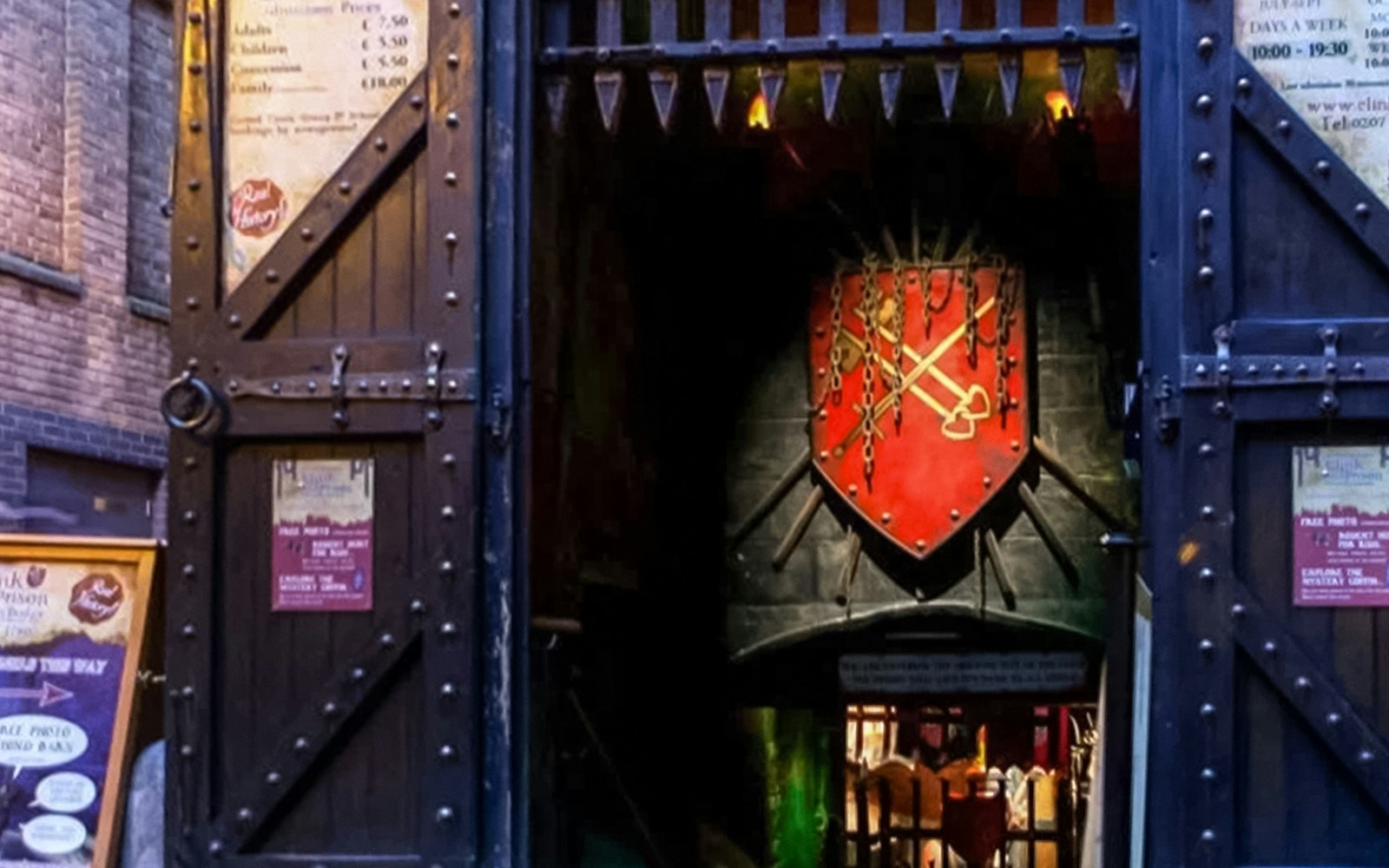 Entrance to The Clink Prison Museum in London with medieval decor and signage.