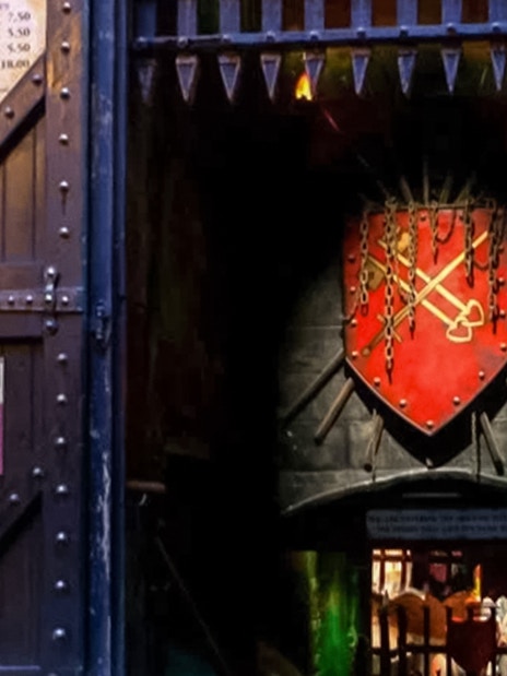 Entrance to The Clink Prison Museum in London with medieval decor and signage.