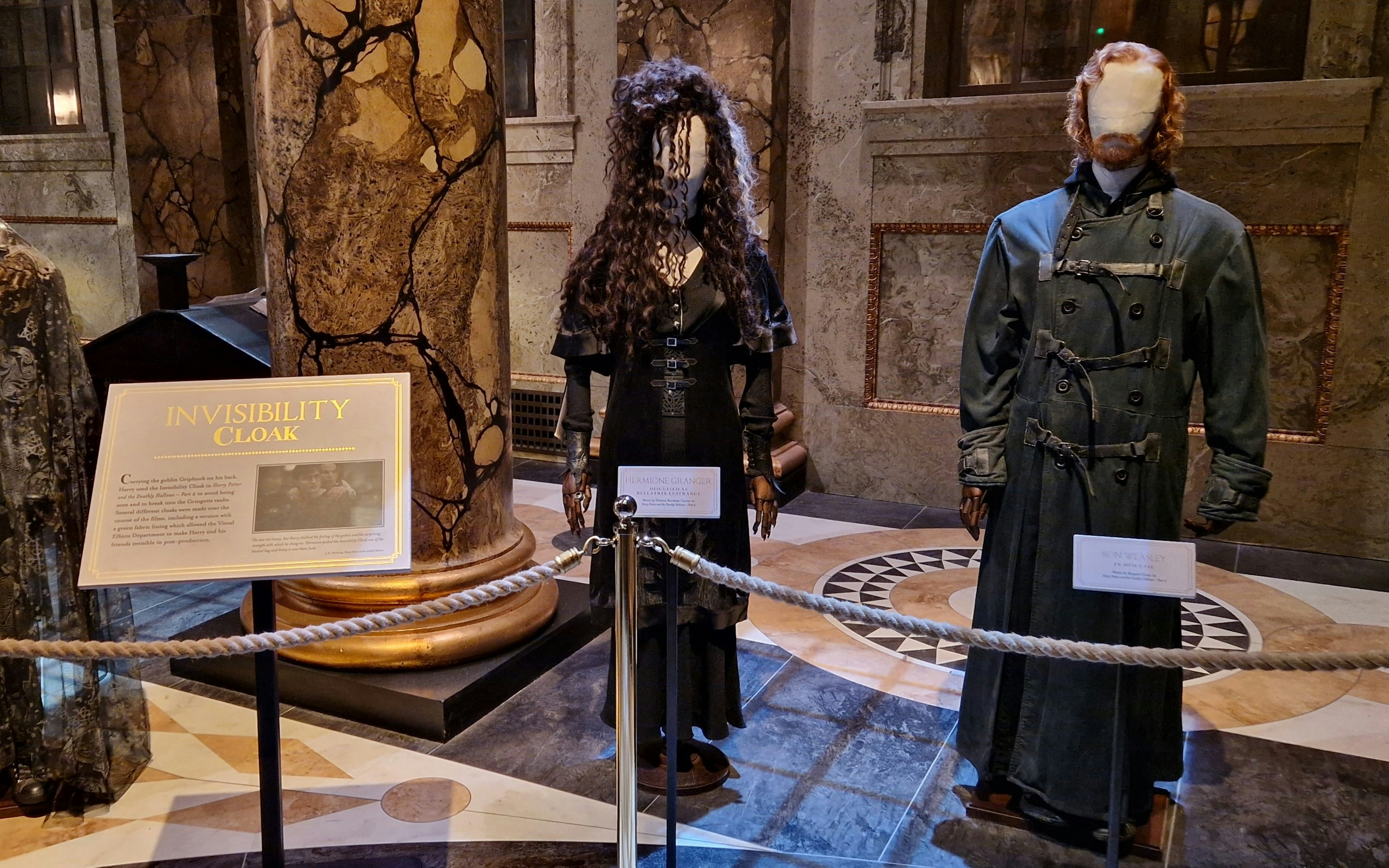 Costumes of Hermione Granger and Ron Weasley displayed during Harry Potter tour.