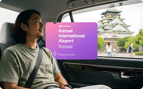 Private car transfer from Kansai International Airport with view of Osaka Castle.