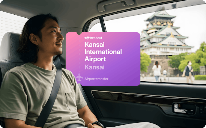 Private car transfer from Kansai International Airport with view of Osaka Castle.