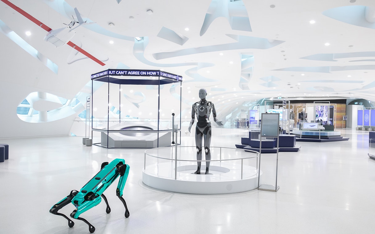 Visitors exploring futuristic exhibits at the Museum of The Future in Dubai.