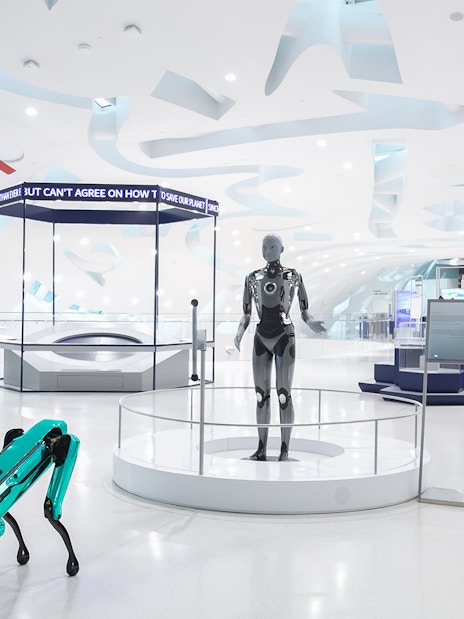 Visitors exploring futuristic exhibits at the Museum of The Future in Dubai.