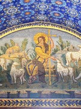 Ravenna mosaic depicting a shepherd with sheep under a blue starry sky.