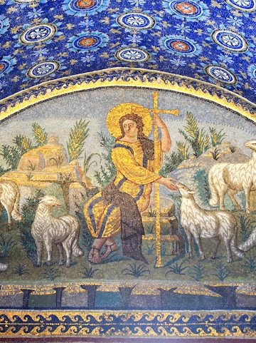 Ravenna mosaic depicting a shepherd with sheep under a blue starry sky.