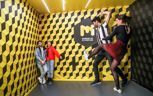 Visitors interacting with optical illusions at the Museum of Illusions.