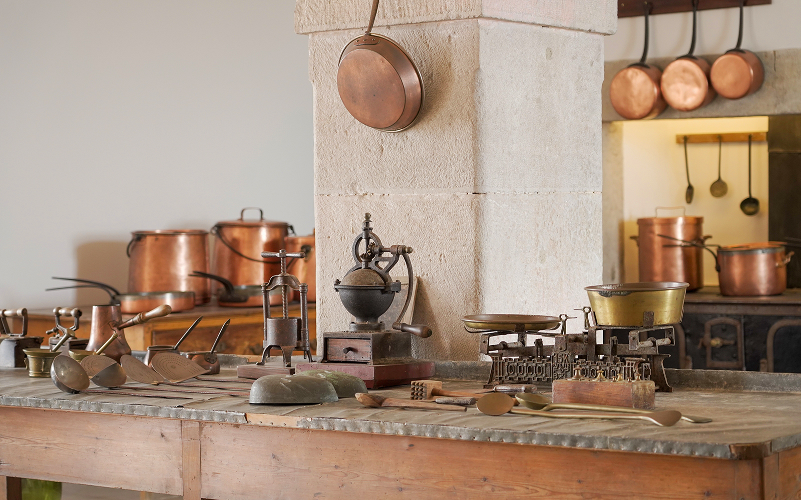Kitchen tools and copper pots in the historic kitchen of Pena Palace, Sintra, Portugal.