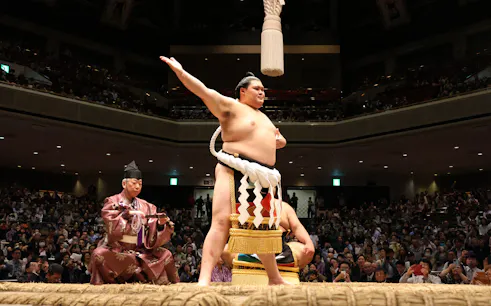 Sumo wrestler performing ritual at Nagoya Grand Sumo Tournament in Japan.