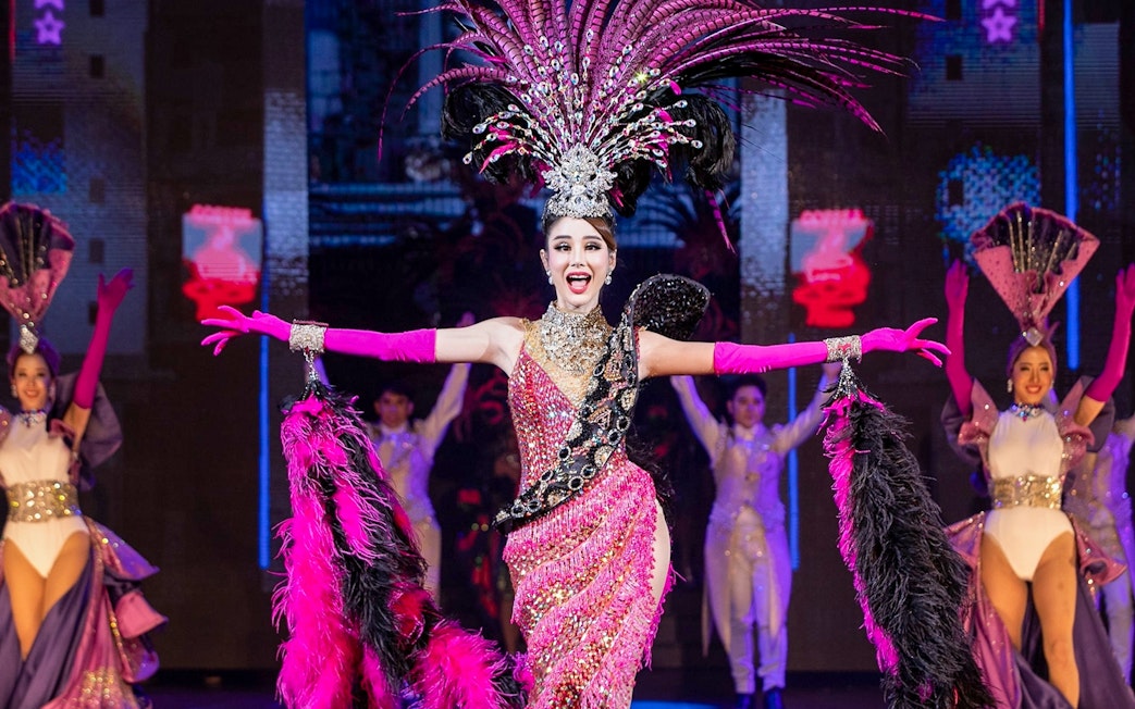Performer in vibrant costume at Tiffany's Show, Pattaya stage.