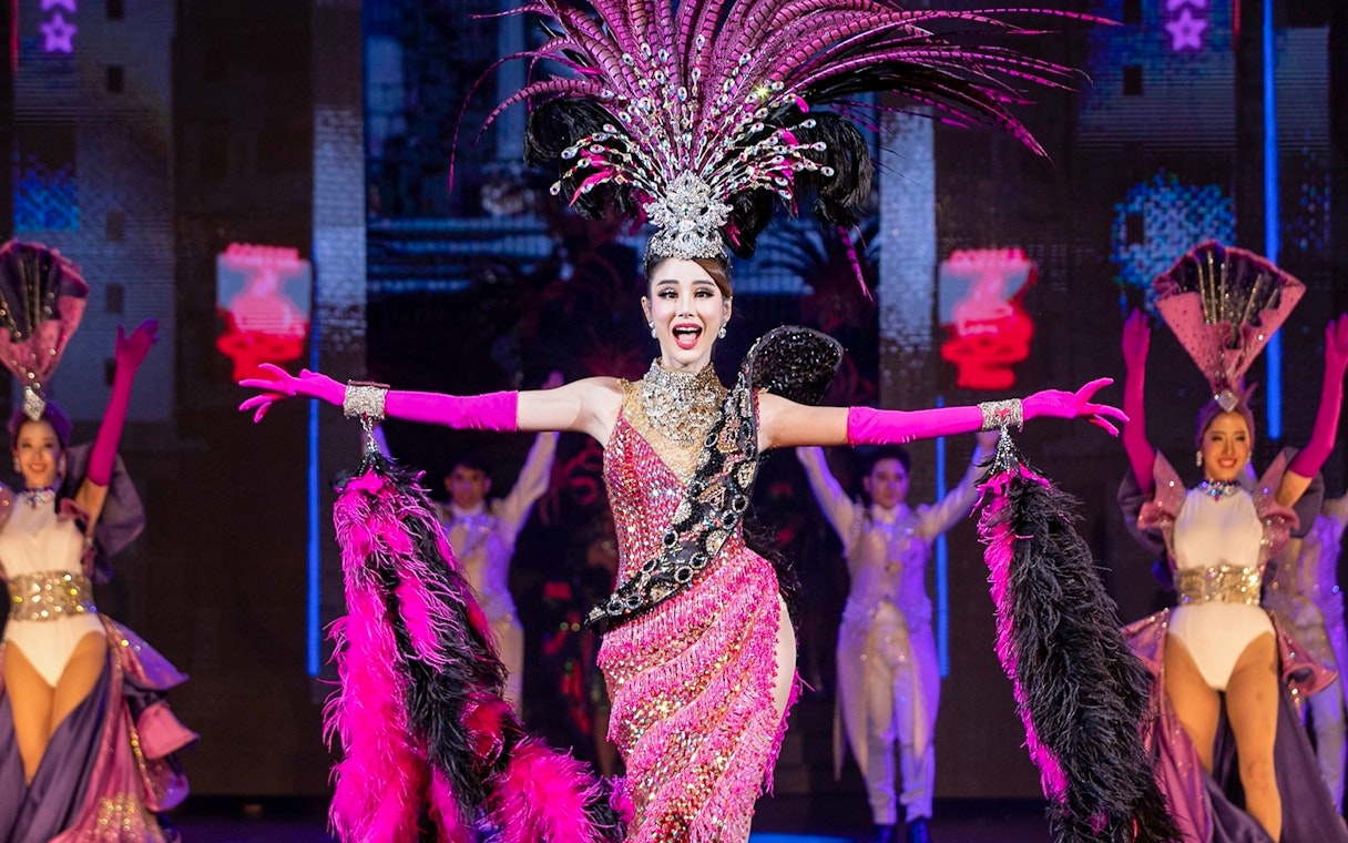Performer in vibrant costume at Tiffany's Show, Pattaya stage.