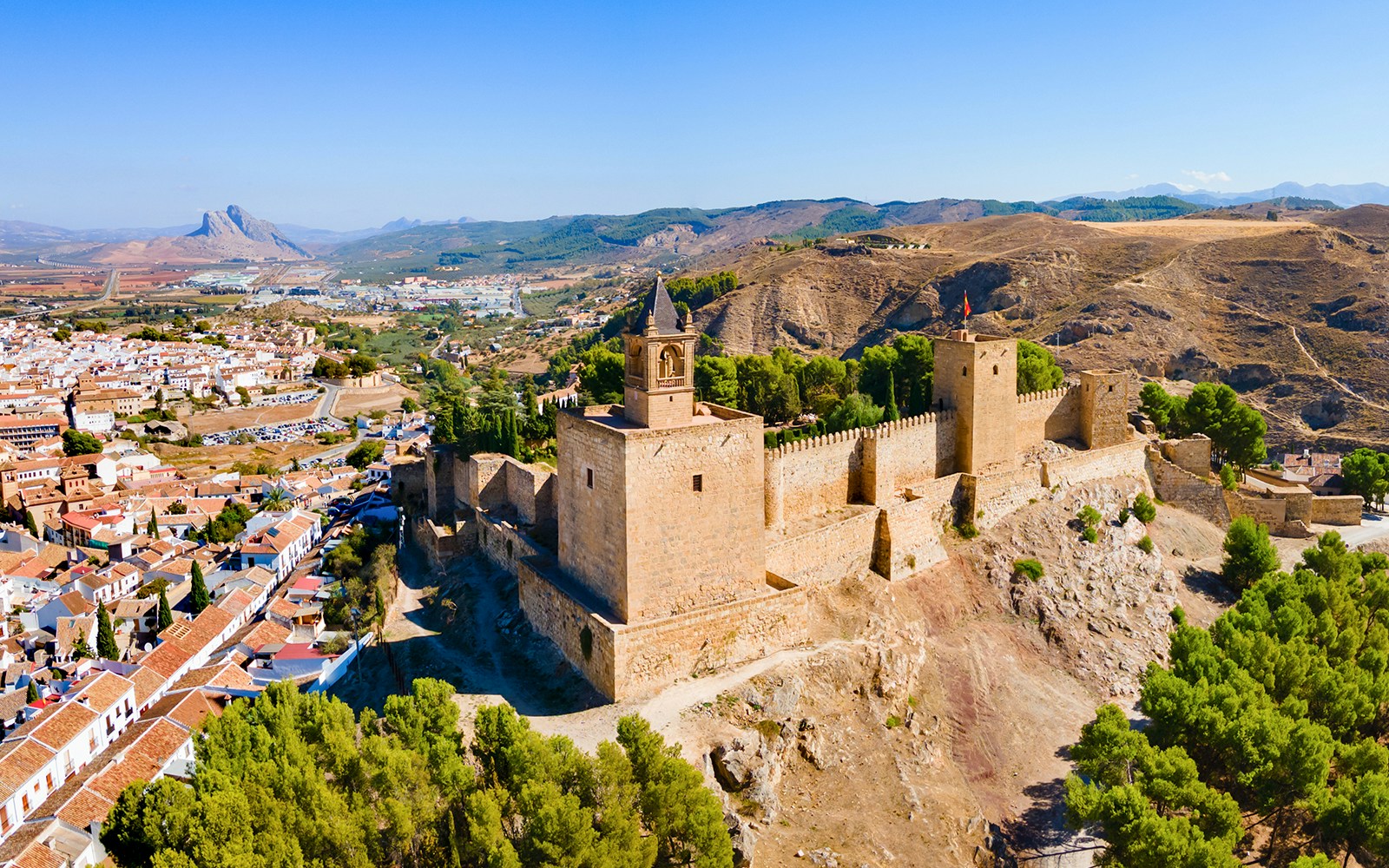 Alcazaba fortress in Antequera, Spain, with surrounding landscape and town.