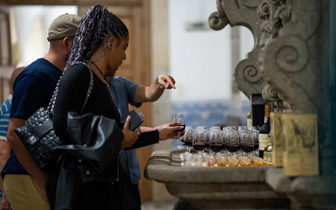 Tasting Port wine and Singeverga liqueur at a historic venue.