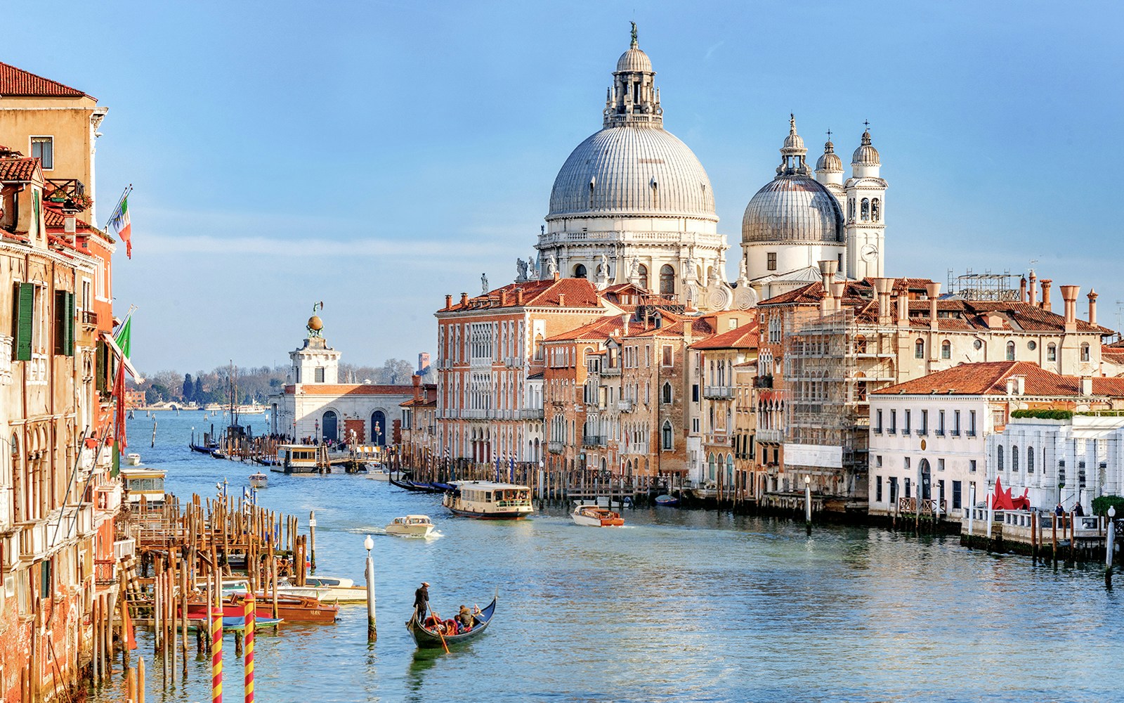 Gondola on Venice Grand Canal with Santa Maria della Salute in the background.