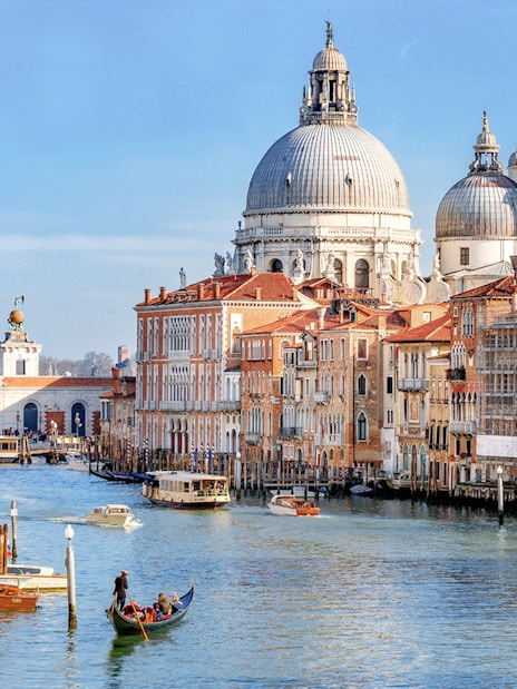 Gondola on Venice Grand Canal with Santa Maria della Salute in the background.