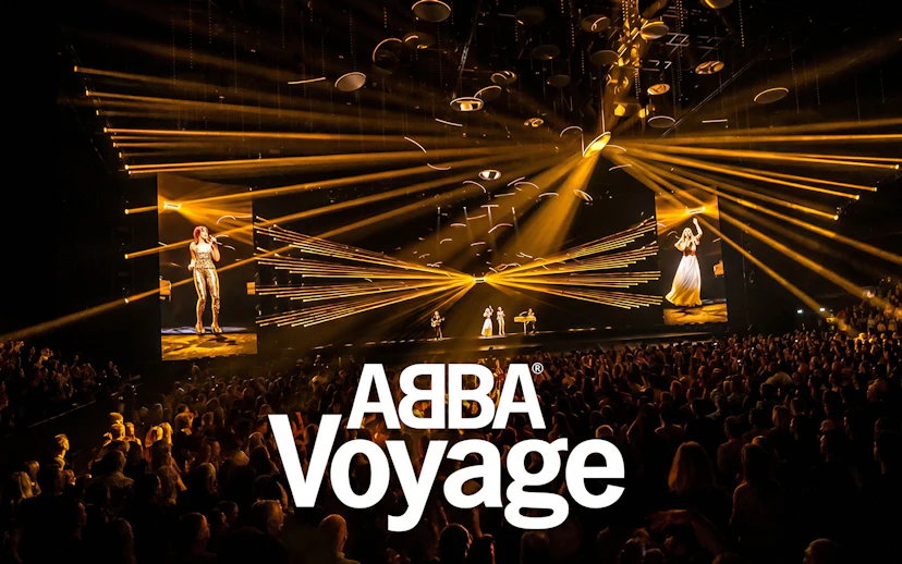 ABBA Voyage Westend show with vibrant stage lights and audience.