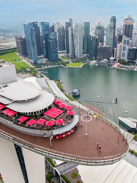Aerial view of SkyPark Observation Deck overlooking Marina Bay and Singapore skyline.
