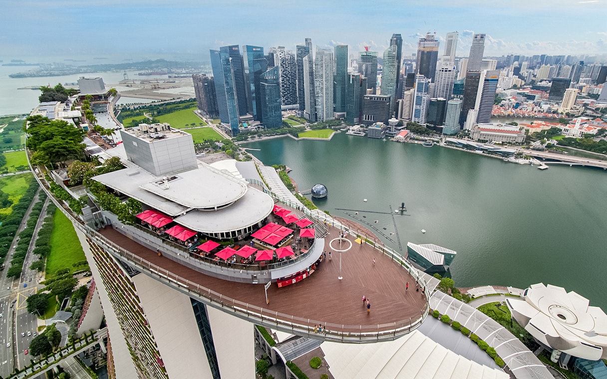 Aerial view of SkyPark Observation Deck overlooking Marina Bay and Singapore skyline.