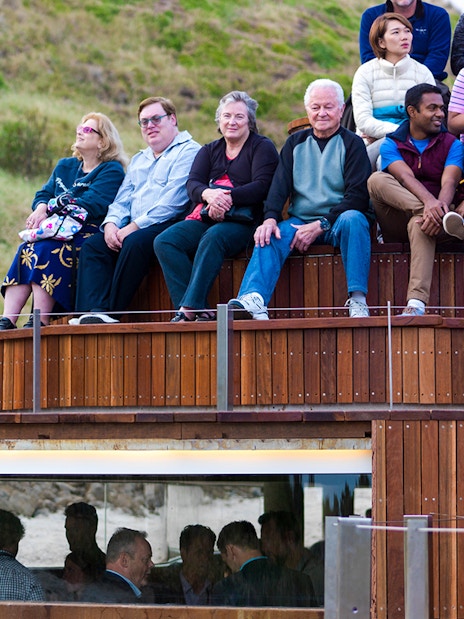 Visitors seated at Phillip Island Nature Parks viewing area for Penguin Parade.