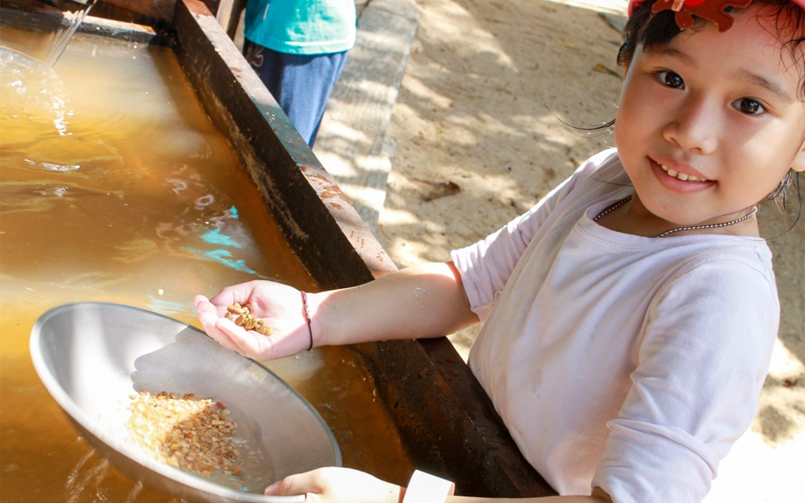 Children exploring interactive exhibits at ESCAPE Penang Discovery Dig, Malaysia.