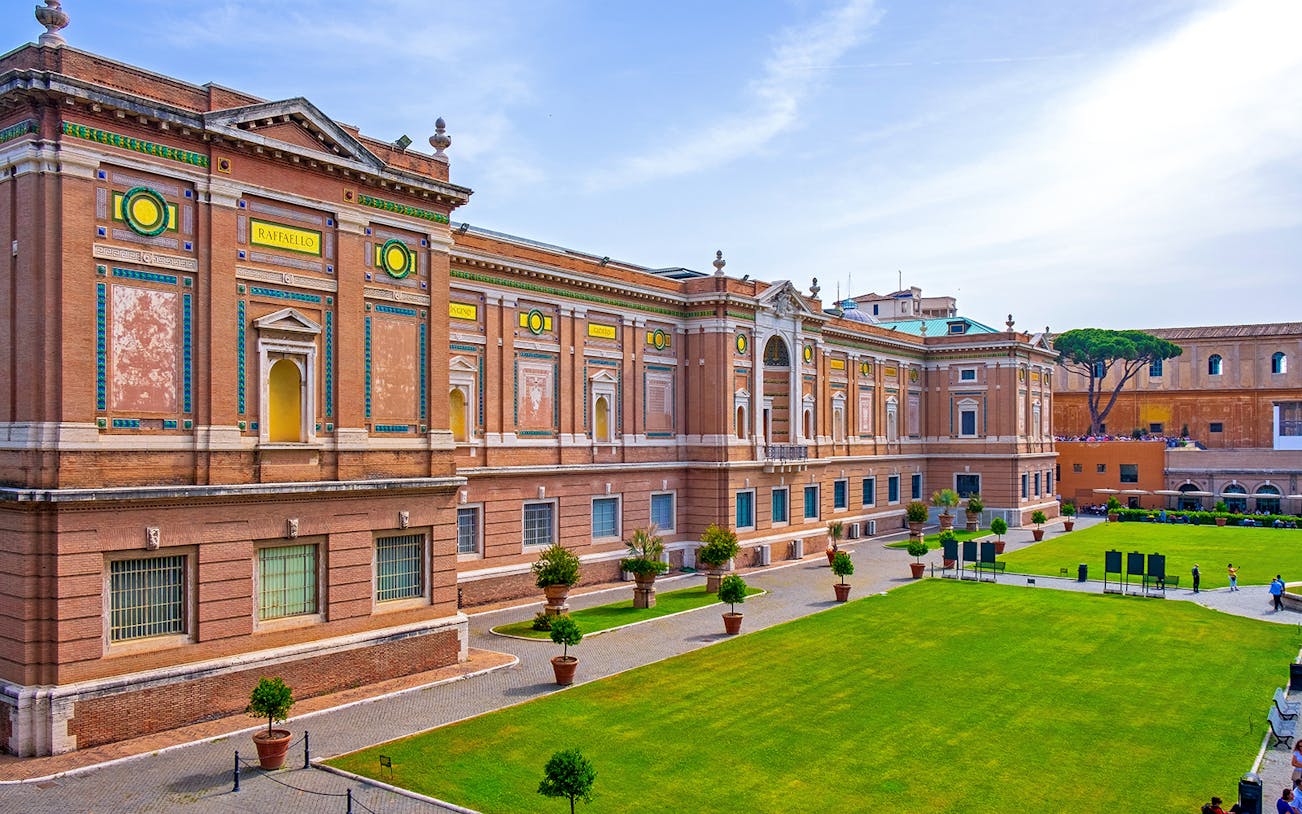 Panoramic view of the Vatican Museums' courtyard and facade in Vatican City.