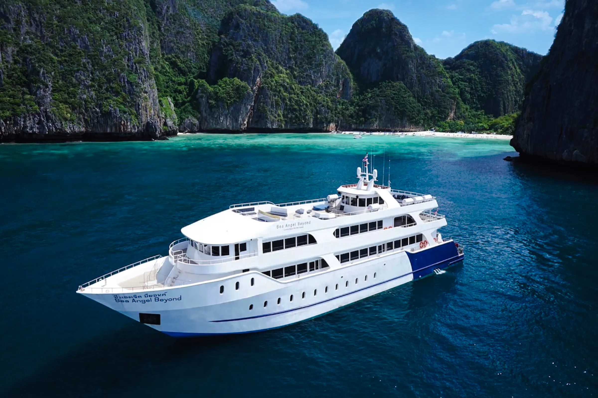 Premium ferry cruising near limestone cliffs, Phuket to Phi Phi transfer.