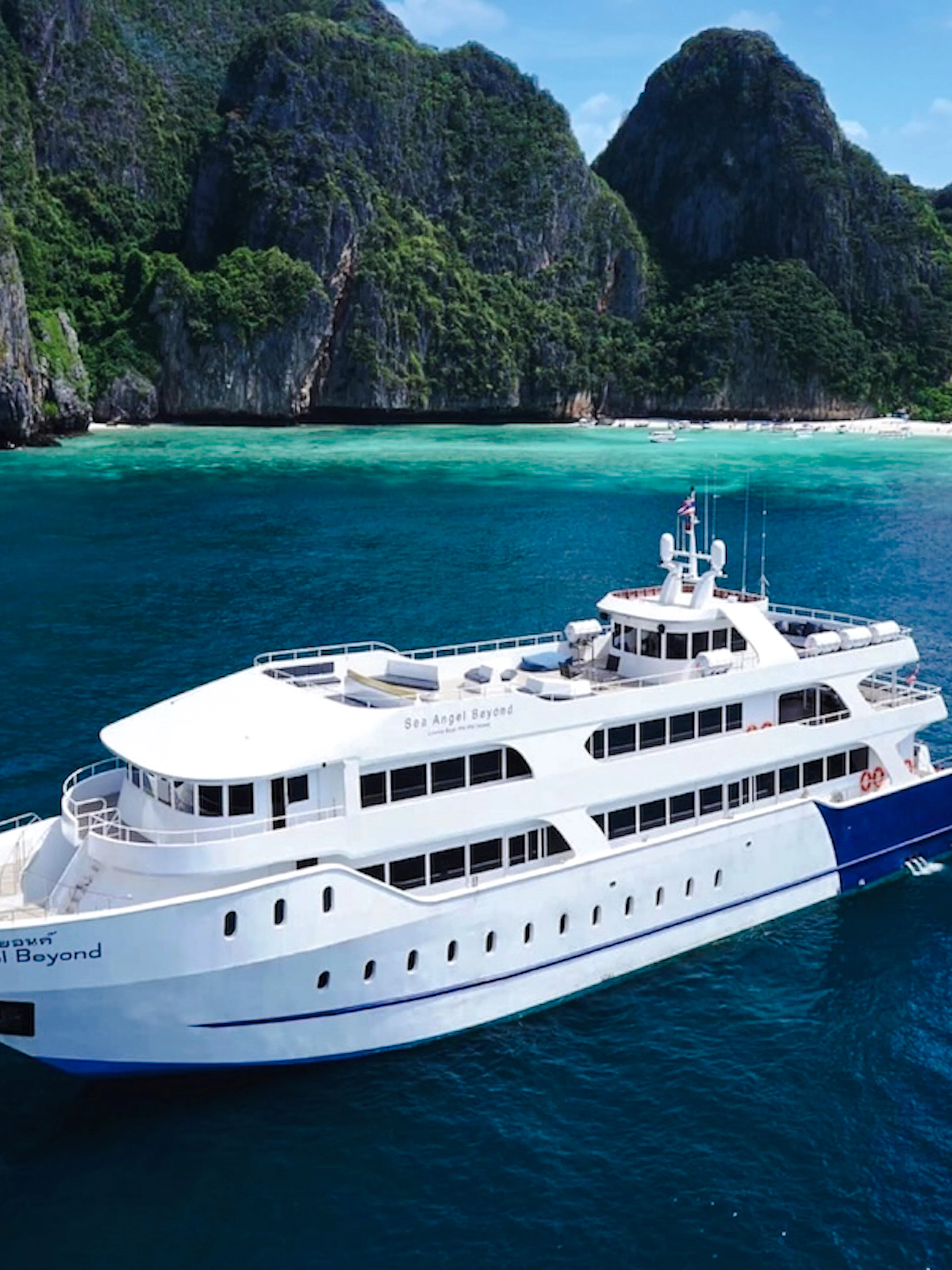 Premium ferry cruising near limestone cliffs, Phuket to Phi Phi transfer.