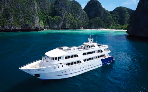 Premium ferry cruising near limestone cliffs, Phuket to Phi Phi transfer.