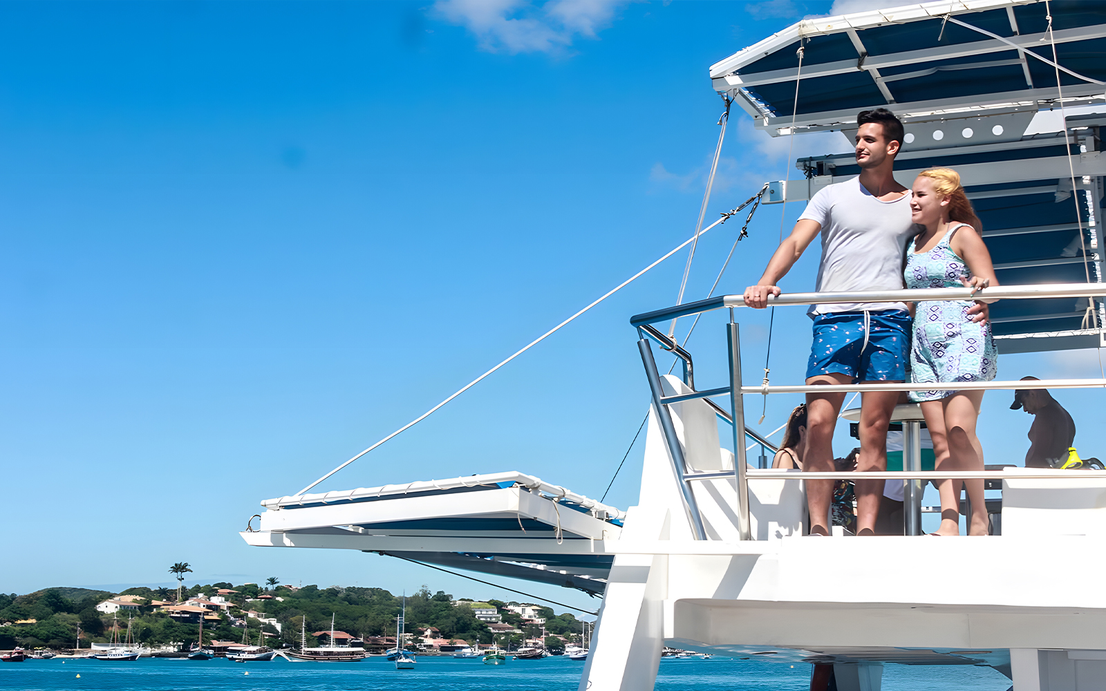 Couple enjoying view from catamaran on Buzios Full Day Tour.