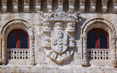 Belém Tower's royal coat of arms detail, part of Belém Essential Combo tour in Lisbon.