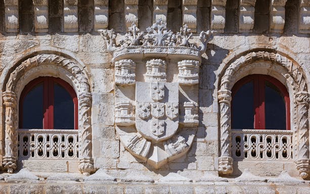 Belém Tower's royal coat of arms detail, part of Belém Essential Combo tour in Lisbon.