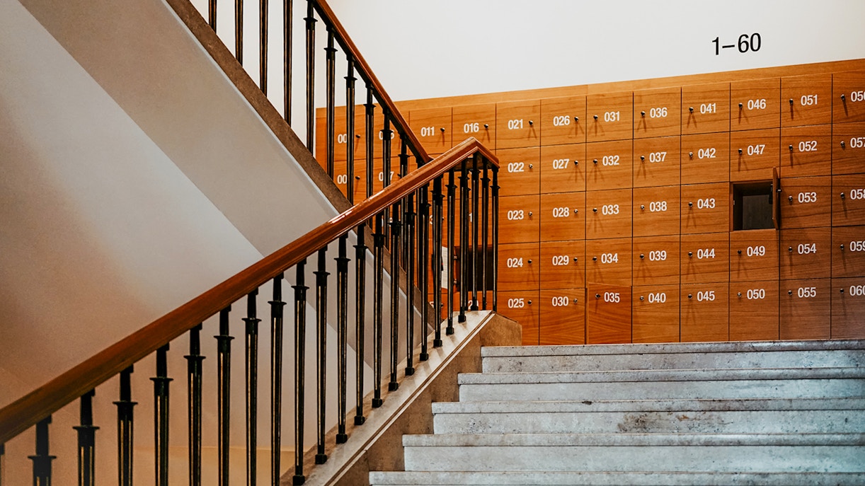 Museum cloakroom with lockers for visitor belongings.