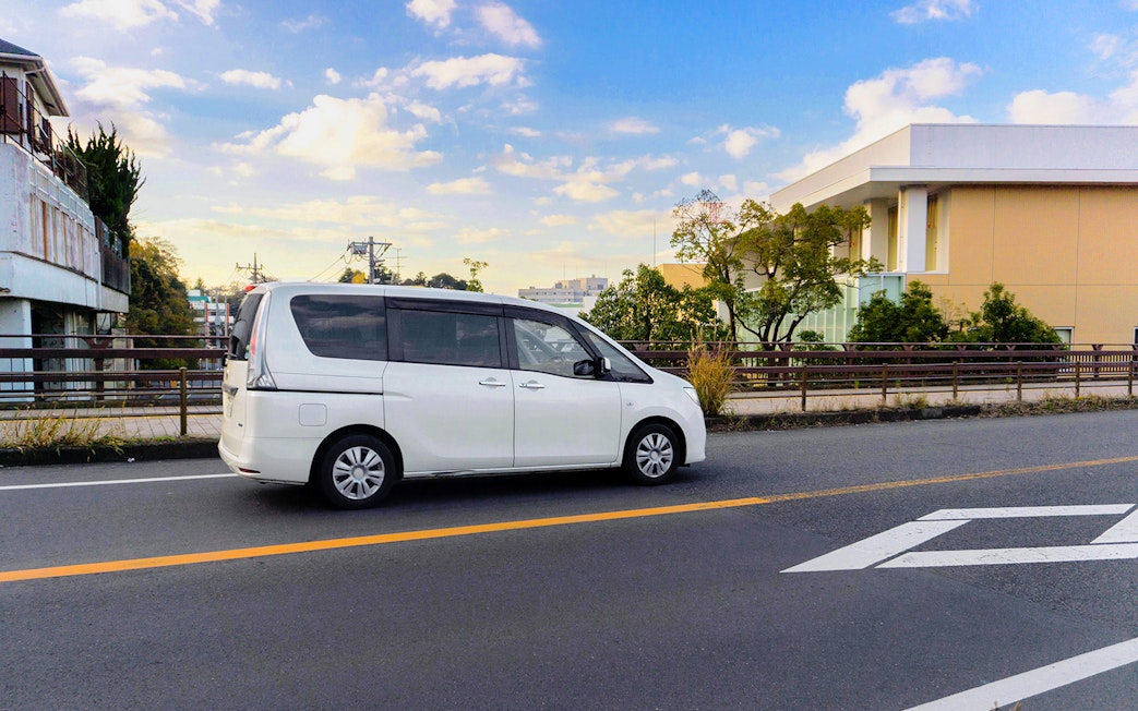 White van on a road, part of the St Tropez & Port Grimaud Day Tour from Nice.