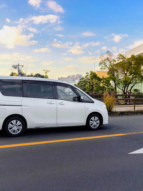 White van on a road, part of the St Tropez & Port Grimaud Day Tour from Nice.