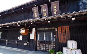 Okuhida Brewery entrance with traditional sake barrels, Gero, Gifu.
