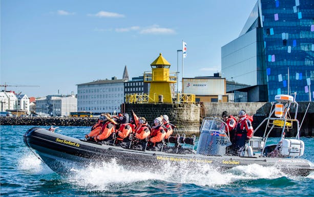 Guests on RIB speedboat for whale watching and puffin tour departing Reykjavik harbor.