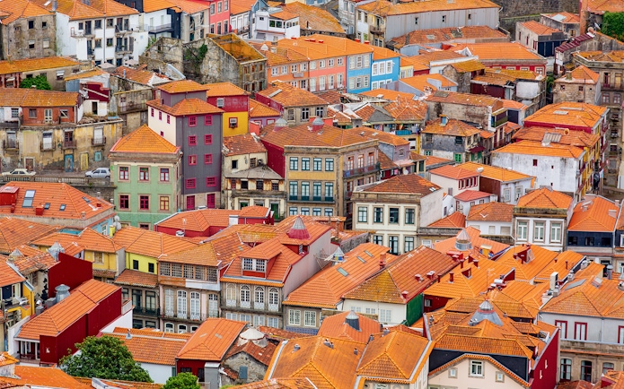 Aerial view of colorful rooftops in Porto near Misericórdia Museum and Church.