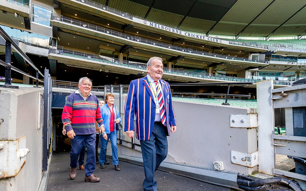 Tour group at Melbourne Cricket Ground entrance during Sports Lovers Day Tour.