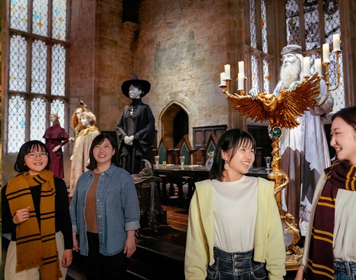 Visitors exploring the Great Hall at Hogwarts, Warner Bros. Studio Tour Tokyo.