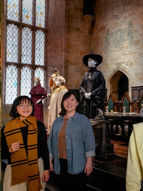 Visitors exploring the Great Hall at Hogwarts, Warner Bros. Studio Tour Tokyo.