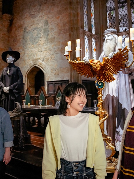 Visitors exploring the Great Hall at Hogwarts, Warner Bros. Studio Tour Tokyo.