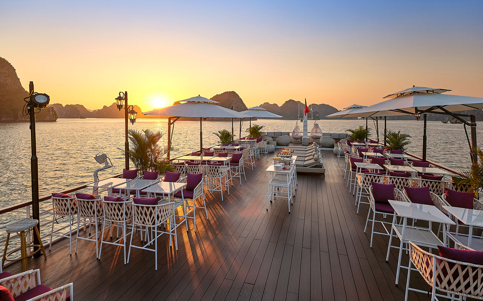 Sunset view from a luxury deck on a Ha Long Bay 5-Star Cruise, Vietnam.