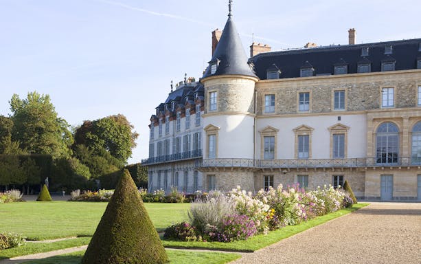 Château de Rambouillet with manicured gardens and historic architecture in France.