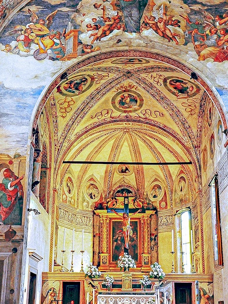 Interior of Santa Maria delle Grazie, Milan, with frescoes and ornate altar.